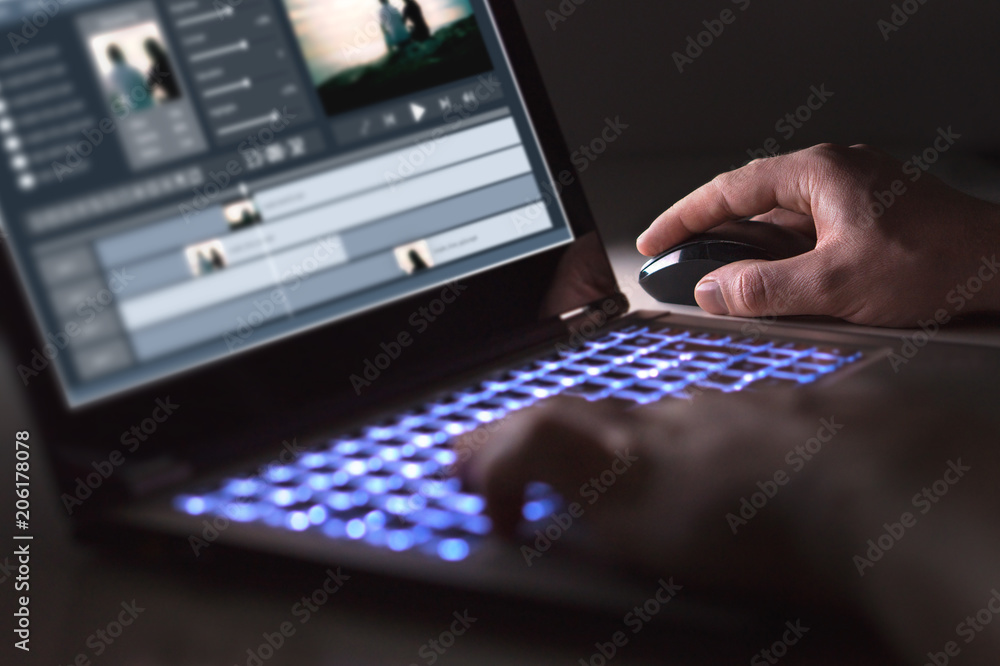Video editing with laptop. Professional editor adding special effects or color grading footage for commercial film or movie. Man using software in computer. - obrazy, fototapety, plakaty 