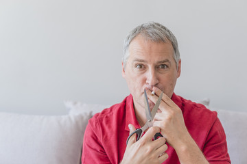 Man trying to quit smoking. Conceptual image