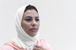 © Eduardo Lopez/ADDICTIVE STOCK - Close up of woman in hijab standing against white background