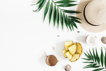 Summer Composition. Tropical Palm Leaves, Hat, Pineapple, Coconut On White Background. Summer Concept. Flat Lay, Top View, Copy Space