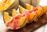 Slices of cantaloupe melon with ham