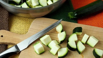 Canvas Print - Healthy chopped zucchini on a cutting board with knife