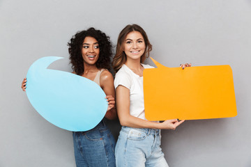 Wall Mural - Portrait of two excited young women