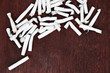 © rahwik - Cigarette butts on wood background. Smoking is bad for your health. Copy space. Top view.