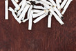 © rahwik - Cigarette butts on wooden background top view. Copy space