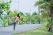 © reewungjunerr - Asian sporty woman stretching body breathing fresh air in the park,Thailand people,Fitness and  exercise concept