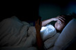 © reewungjunerr - Asian woman play smartphone in the bed at night,Thailand people