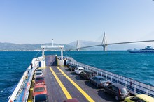 Traveling By Ferry Boat Of Rio At Patra, Greece. Rio- Antirio Cable Stayed Bridge On The Background
