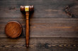 Law or jurisprudence concept. Judge gavel on dark wooden background top view copy space