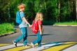 © nadezhda1906 - little boy and girl holding hands go to school