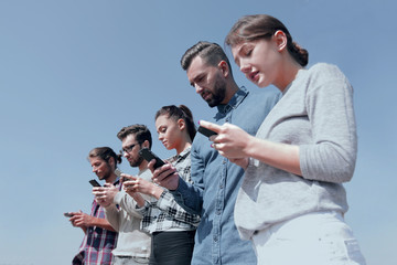 Wall Mural - young people using smartphones to search network