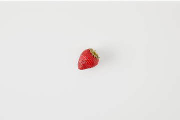 Wall Mural - top view of ripe strawberry isolated on white