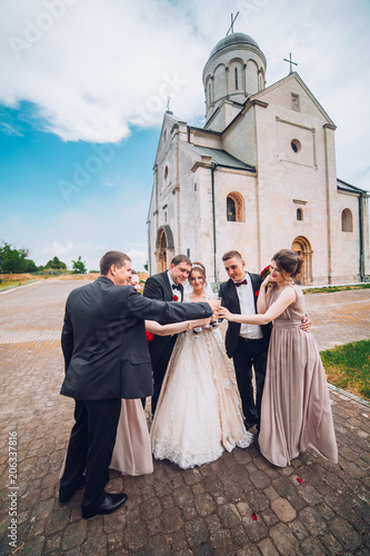 Cheerful And Fun Groom With Bride Bridesmaids With Groomsmen