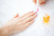 © Maksymiv Iurii - Beauty and Care. Beautiful Women's Hands with Perfect Manicure. Manicure Master Applying Nail Polish in a Beauty Salon. Beauty Day. Spa Manicure. Hand and Nail Care
