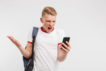 Sticker - Portrait of an angry teenage boy standing with backpack