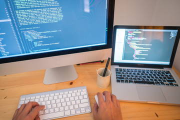 Wall Mural - close up hand of developing programming and coding technologies. programmer hand typing on keyboard.