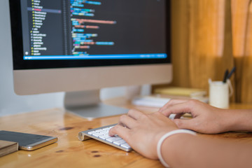 Wall Mural - close up hand of developing programming and coding technologies. programmer hand typing on keyboard.
