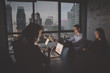 © S photographer - Business Overtime Concepts . Group of business people working overtime in nighttime. Businessmen are serious about office work. Businessmen working late at night after work.