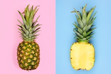 Creative Pineapple Layout. Whole Fruit On Pastel Pink, Half Slice With Blue Background. Minimal Summer Concept Top View.