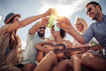 Canvas Print - Group of friends having fun on the beach