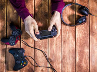 Poster - video gaming devices kit on the wooden table copy space