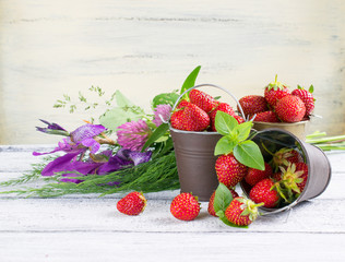 Wall Mural - Strawberry in a bucket and flowers