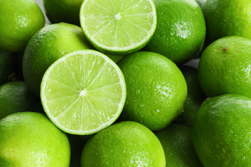 Fresh ripe green limes as background