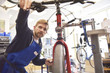 © Westend61 - Bicycle mechanic working in his repair shop