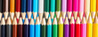 Set of colored pastel pencils in row multi color in form of closed zipper