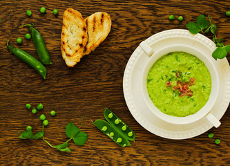 Wall Mural - Soup of green peas with bacon and mint.