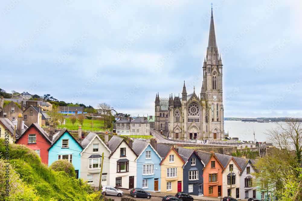 Cathedral  and colored houses in Cobh, Ireland - obrazy, fototapety, plakaty 