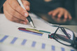 © photobyphotoboy - Business people are working on accounts in business analysis with graphs and documentation.