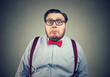 Confused chunky man in bow tie