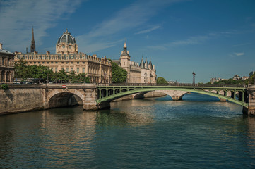 Sticker - Bridge over the Seine River and the Conciergerie building with sunny blue sky at Paris. Known as the “City of Light”, is one of the most impressive world’s cultural center. Northern France.