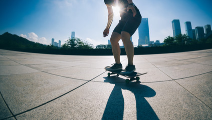 Wall Mural - Skateboarder skateboarding at city