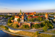 Poland. Krakow Skyline With Wawel Hill, Cathedral, Royal Wawel Castle, Defensive Walls,Vistula Riverbank, Park, Promenade, Walking People. Old City In The Background