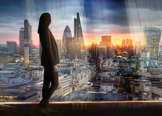 Sticker - Young woman looking over the City of London at sunset. Future, new business opportunity and business success concept.