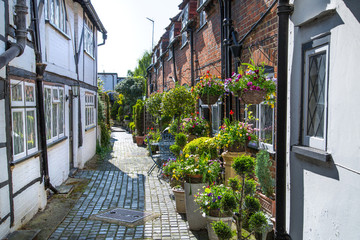 Poster - Windsor, UK - May 5, 2018: Little street in old Eton, decorated with flower pots