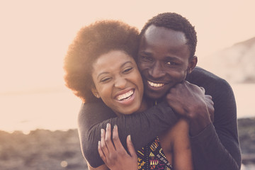 beautiful black race nice model couple man and woman young age hug and stay together with love and f