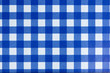 A dark blue gingham fabric background that is seamless