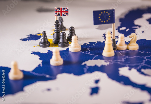 Foto Chess pieces over an european map. Brexit concept