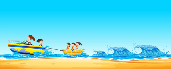 Wall Mural - Kids  Riding Banana Boat in Ocean