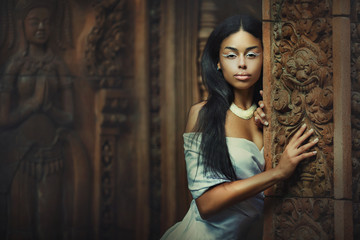 Woman posing in  ancient temple place 