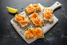 Homemade Crispbread Toast With Smoked Salmon And Soft Chees, Chives On White Board