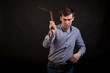 © Aleksandr Kondratov - Dark-haired man in a plaid shirt .holds a nunchuck  in his hands .on black isolated background