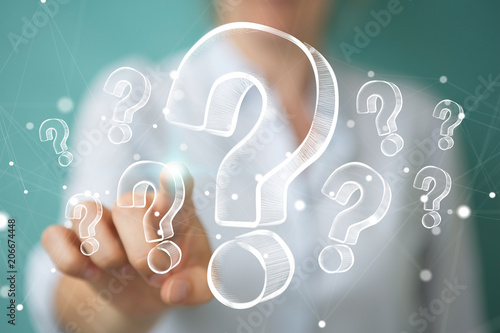 Fotografía Businesswoman touching and holding hand drawn question marks