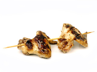 Wall Mural - chicken wings fried on a grill strung on a skewer