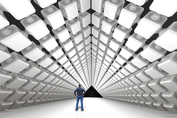 Man is standing in a huge futuristic hall with a perspective