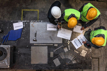 Workers and manager with documents