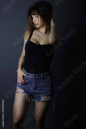 Belle femme brune portant un short et un débardeur - Buy this stock photo  and explore similar images at Adobe Stock | Adobe Stock